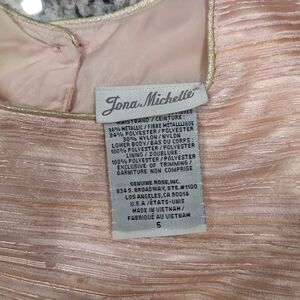 Pink dress with gold detail.